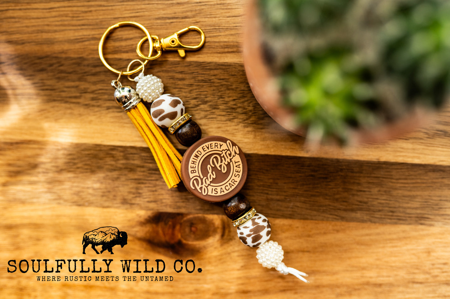 Wild Soul Keychain - "Behind Every Bad Bitch Is a Car Seat" Brown, Beige, Cow Print, Brown and White