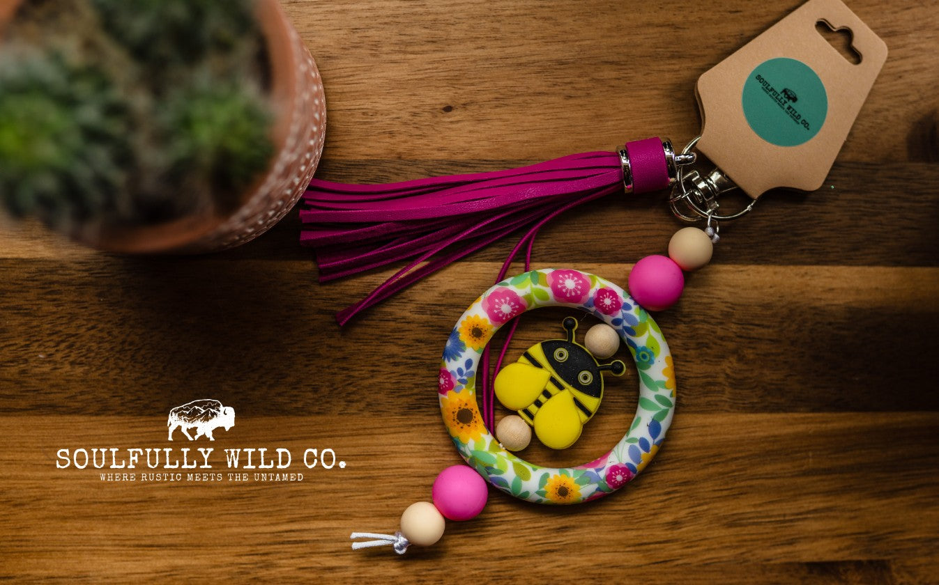 Wild Soul Keychain - Silicone Circle Pink/Yellow and Blue Flowers with Yellow Bee