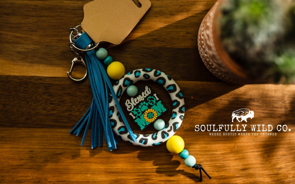 Wild Soul Keychain - Silicone Circle Blue/Black Cow Print "Blessed Dog Mom"