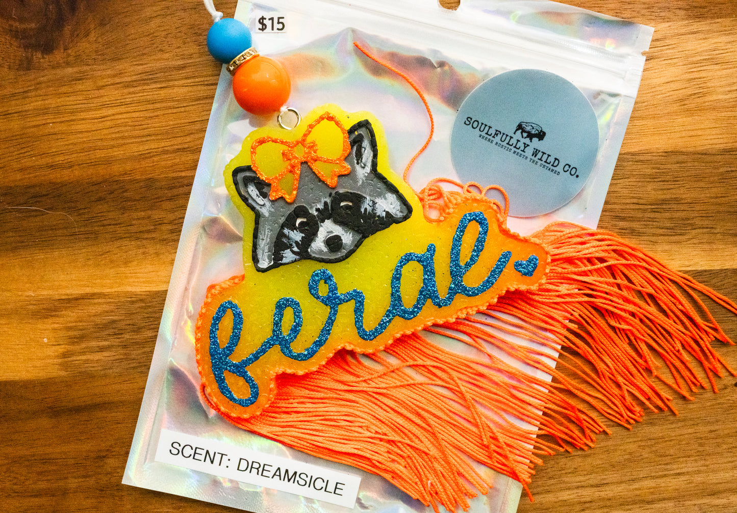 Soulful Air Freshener: Feral Raccoon - Orange/Yellow/Blue (Scent: Dreamsicle)