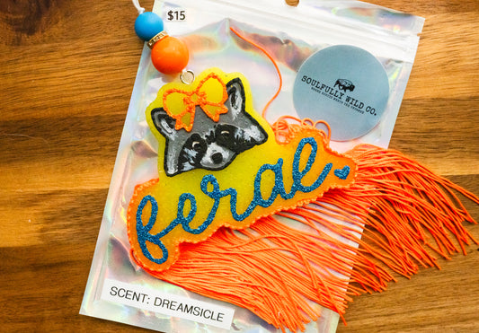 Soulful Air Freshener: Feral Raccoon - Orange/Yellow/Blue (Scent: Dreamsicle)