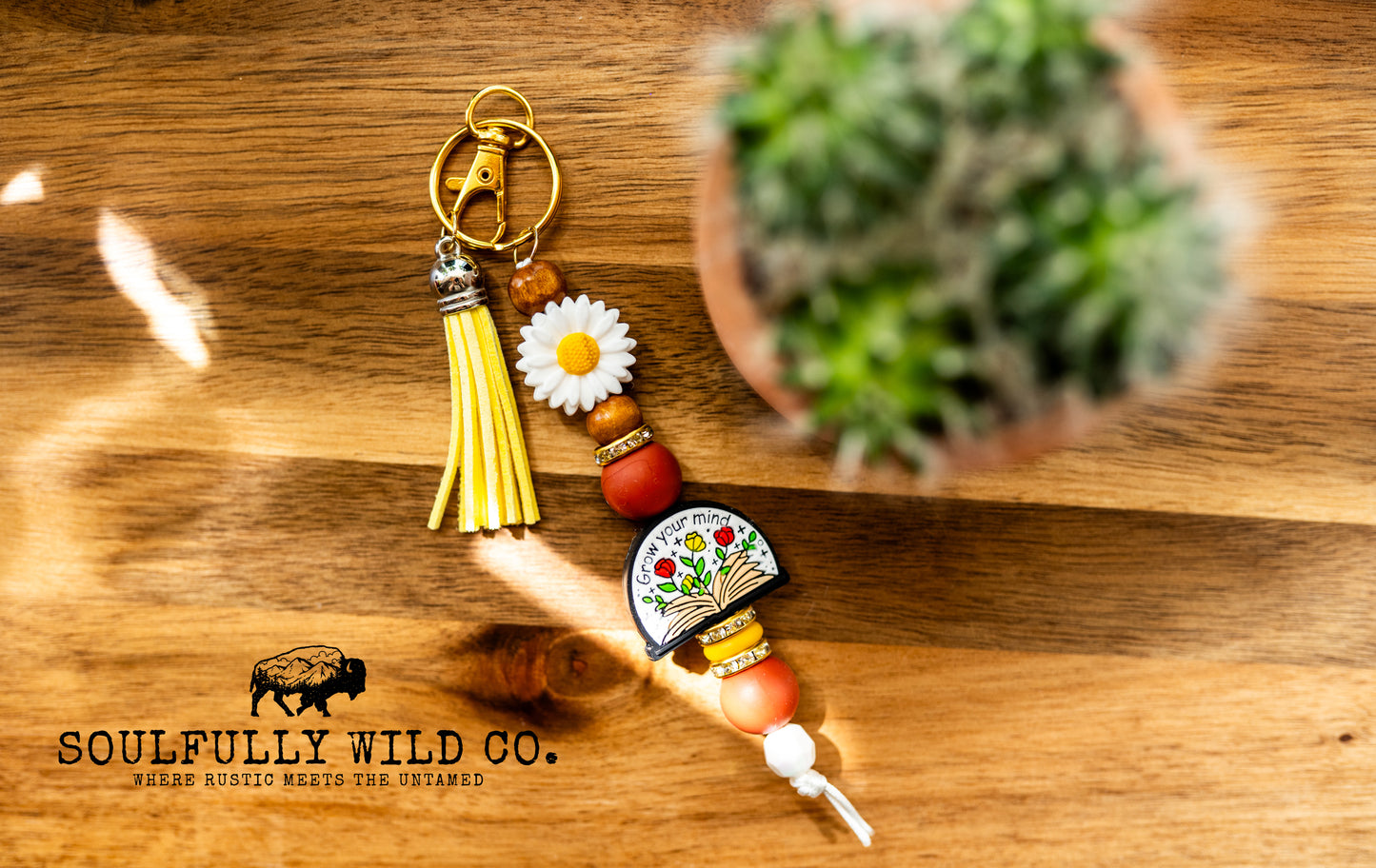 Wild Soul Keychain - "Grow Your Mind" Yellow, White Flower, and Reddish Brown