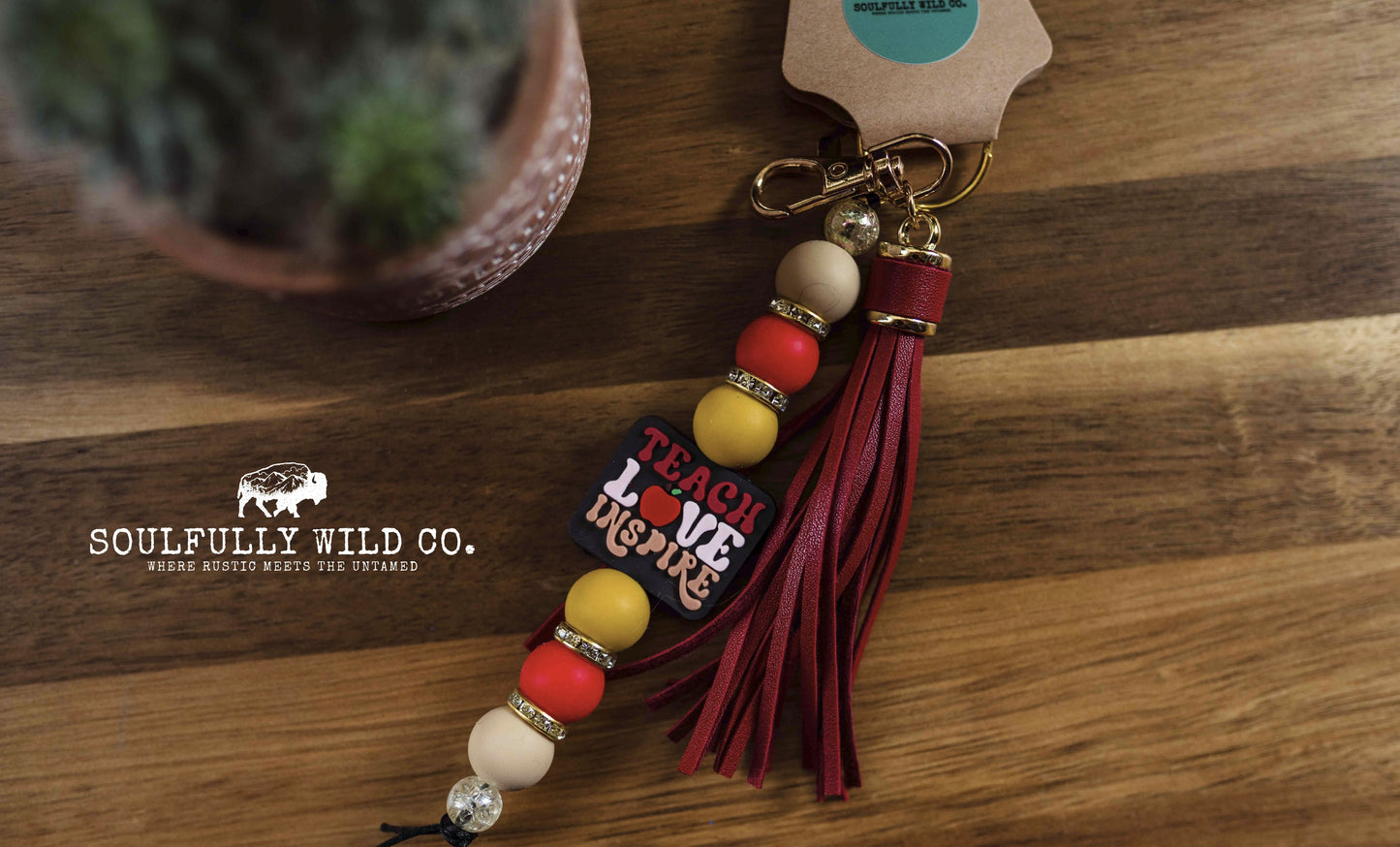 Wild Soul Keychain - "Teach. Love. Inspire" Black with Red Tassel