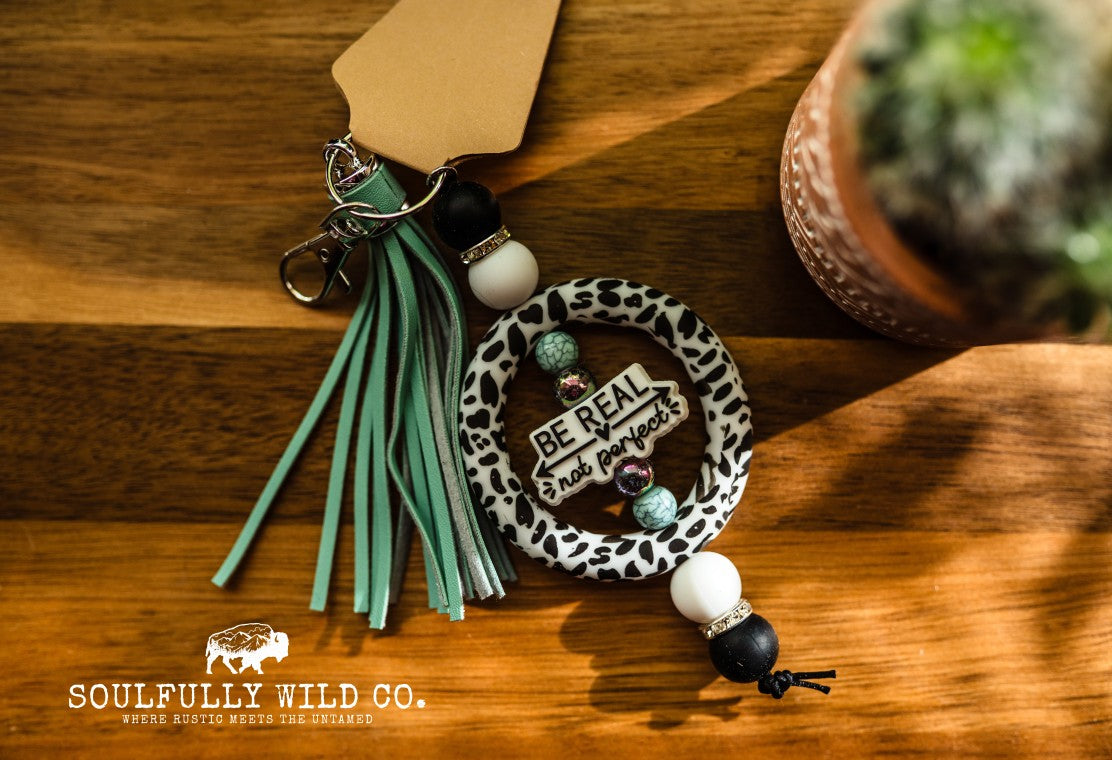 Wild Soul Keychain - Silicone Circle Cow Print "Be Real, Not Perfect"